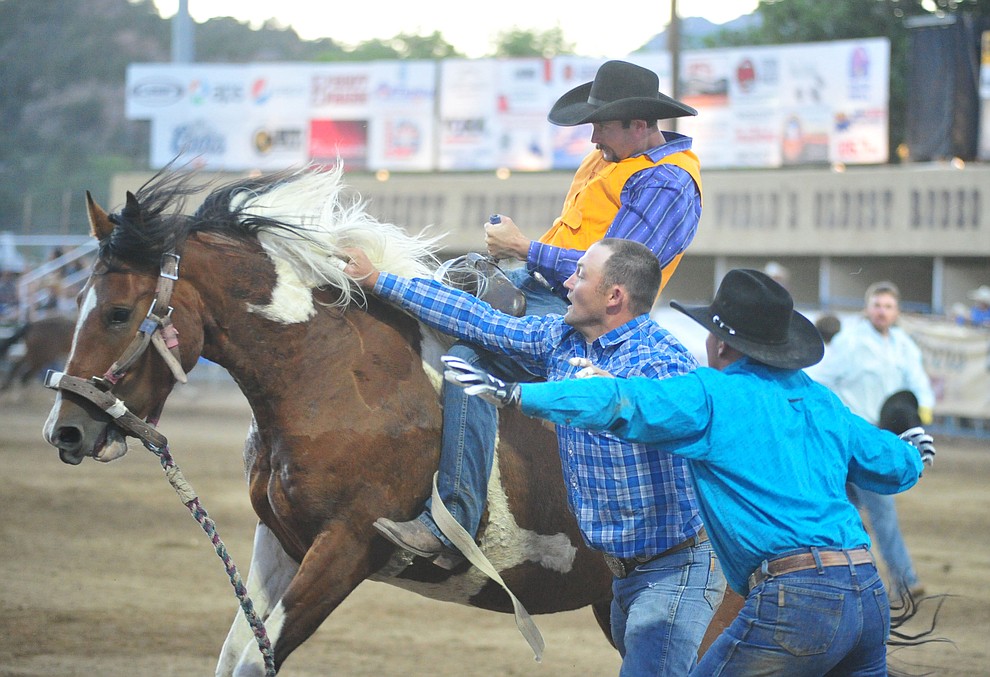 Wild Horse Race action during the first performance of the Prescott Frontier Days Rodeo Monday July 1, 2019. (Les Stukenberg/Courier)