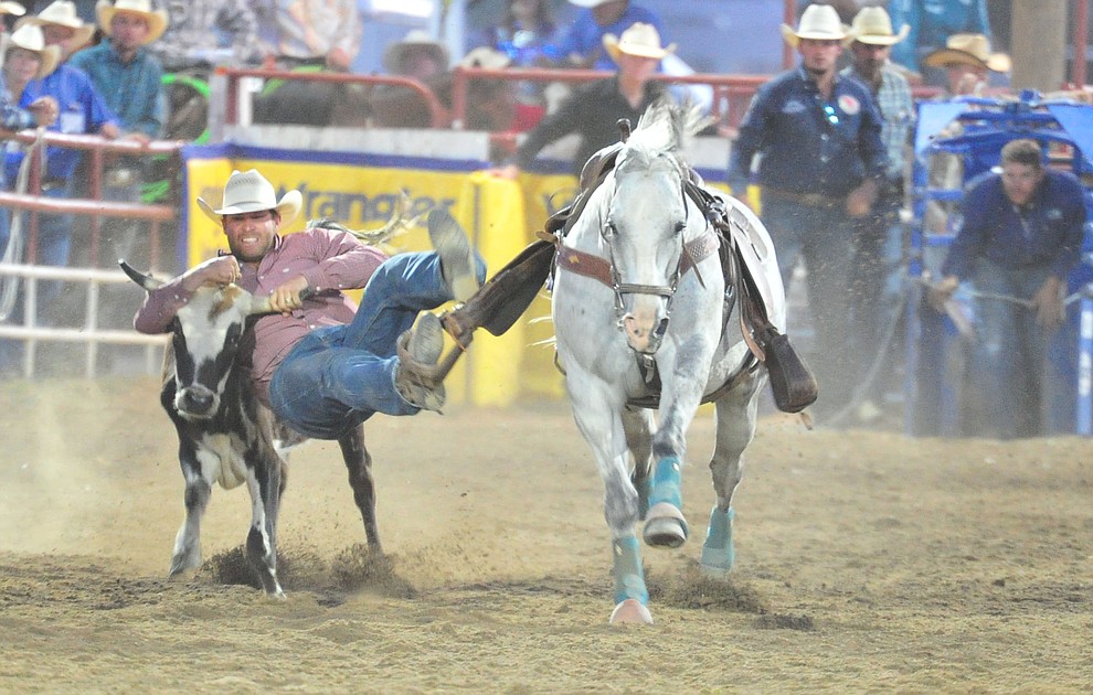 Blair Jones in the steer wrestling during the first performance of the Prescott Frontier Days Rodeo Monday July 1, 2019. (Les Stukenberg/Courier)
