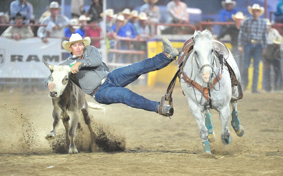 Dru Melvin in the steer wrestling during the first performance of the Prescott Frontier Days Rodeo Monday July 1, 2019. (Les Stukenberg/Courier)