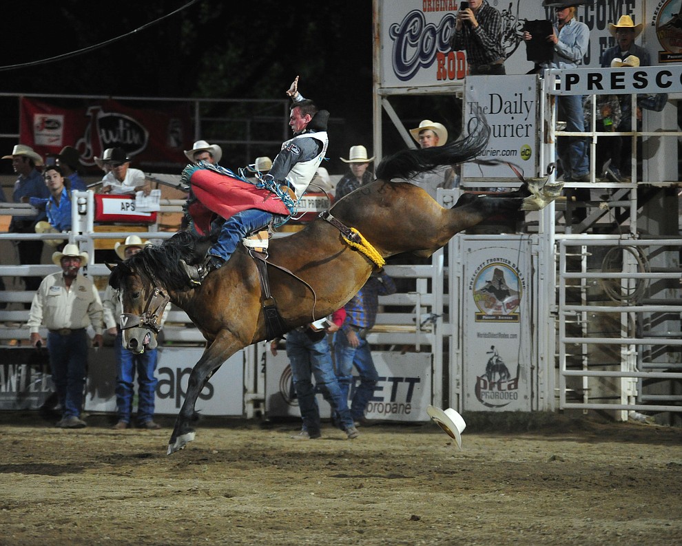Tim O'Connell scores 86 on Sun Glow for the lead in the bareback riding during the first performance of the Prescott Frontier Days Rodeo Monday July 1, 2019. (Les Stukenberg/Courier)