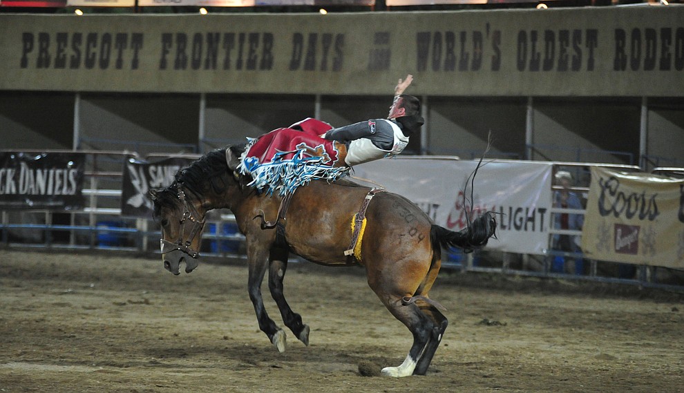 Tim O'Connell scores 86 on Sun Glow for the lead in the bareback riding during the first performance of the Prescott Frontier Days Rodeo Monday July 1, 2019. (Les Stukenberg/Courier)