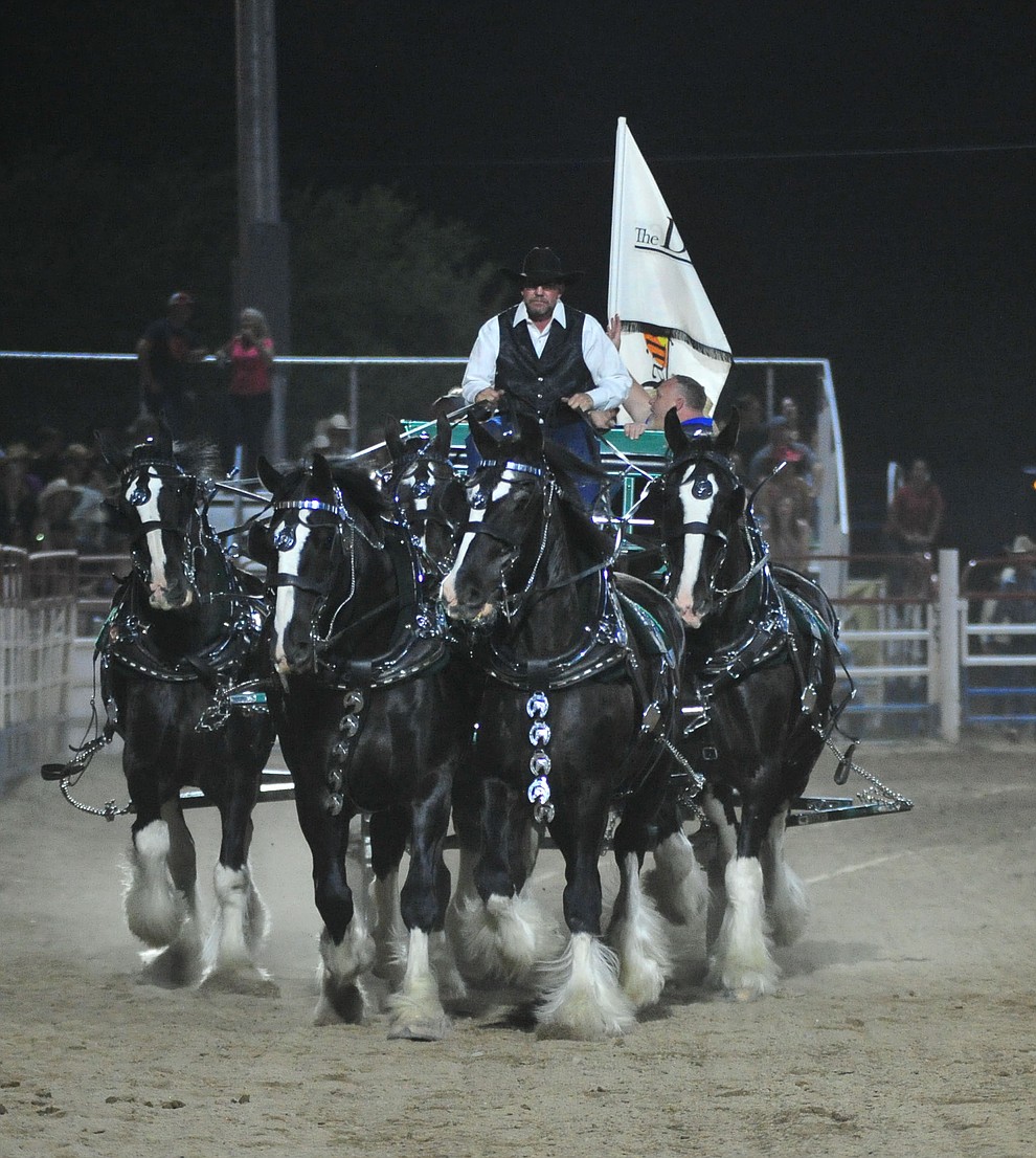 The Diamond Z English Shire Horses thrill the capacity crowd during the first performance of the Prescott Frontier Days Rodeo Monday July 1, 2019. (Les Stukenberg/Courier)