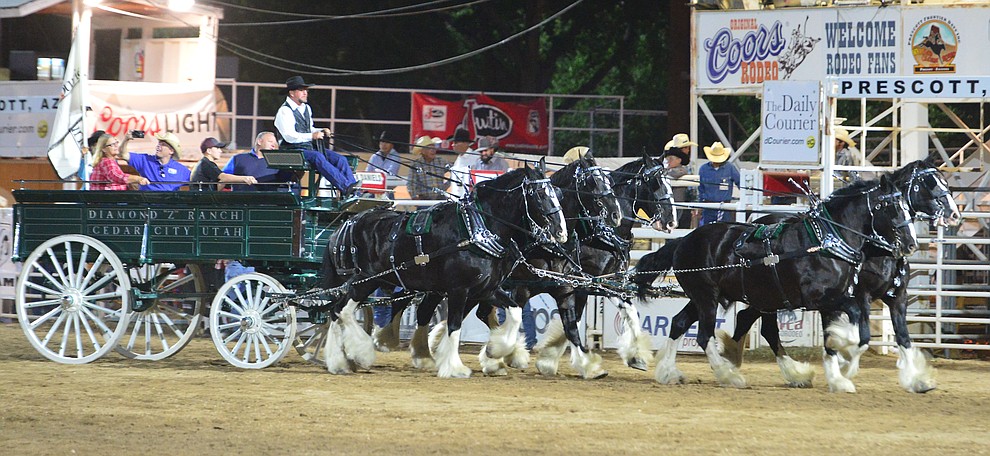 The Diamond Z English Shire Horses thrill the capacity crowd during the first performance of the Prescott Frontier Days Rodeo Monday July 1, 2019. (Les Stukenberg/Courier)
