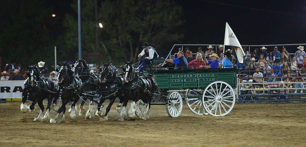 The Diamond Z English Shire Horses thrill the capacity crowd during the first performance of the Prescott Frontier Days Rodeo Monday July 1, 2019. (Les Stukenberg/Courier)