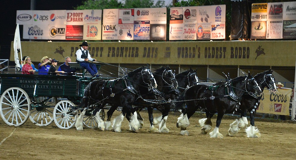 The Diamond Z English Shire Horses thrill the capacity crowd during the first performance of the Prescott Frontier Days Rodeo Monday July 1, 2019. (Les Stukenberg/Courier)