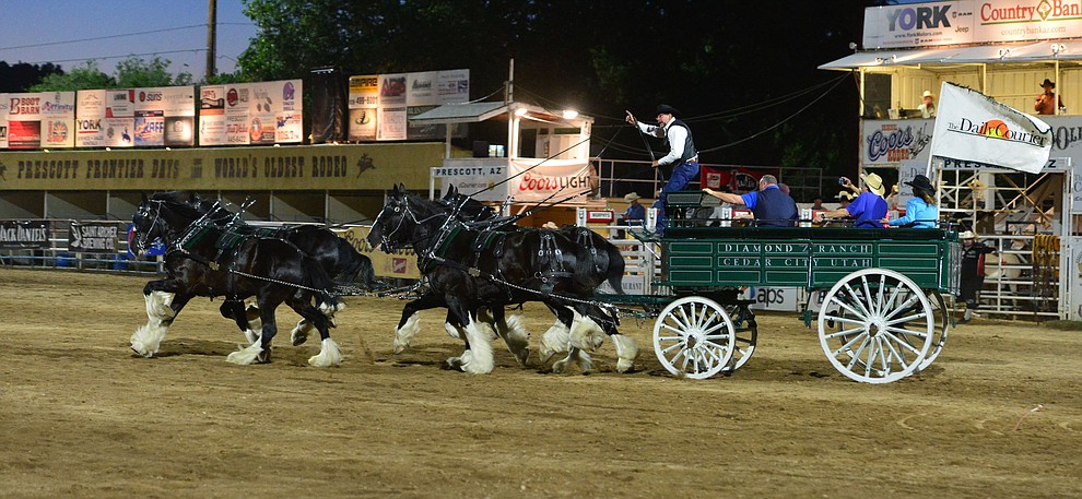 The Diamond Z English Shire Horses thrill the capacity crowd during the first performance of the Prescott Frontier Days Rodeo Monday July 1, 2019. (Les Stukenberg/Courier)