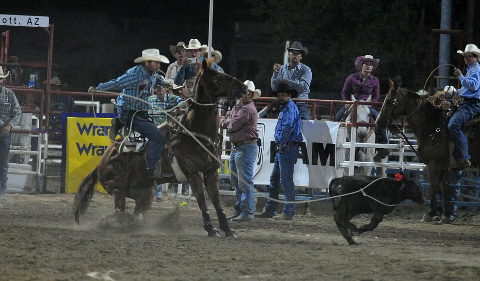 J.D. Kibbe has an 8.5 second run in the tie down roping for the lead during the first performance of the Prescott Frontier Days Rodeo Monday July 1, 2019. (Les Stukenberg/Courier)