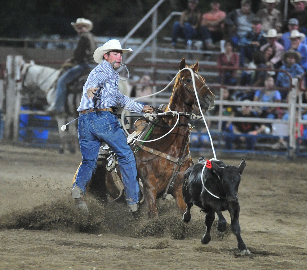 Jesse Clark in the tie down roping during the first performance of the Prescott Frontier Days Rodeo Monday July 1, 2019. (Les Stukenberg/Courier)