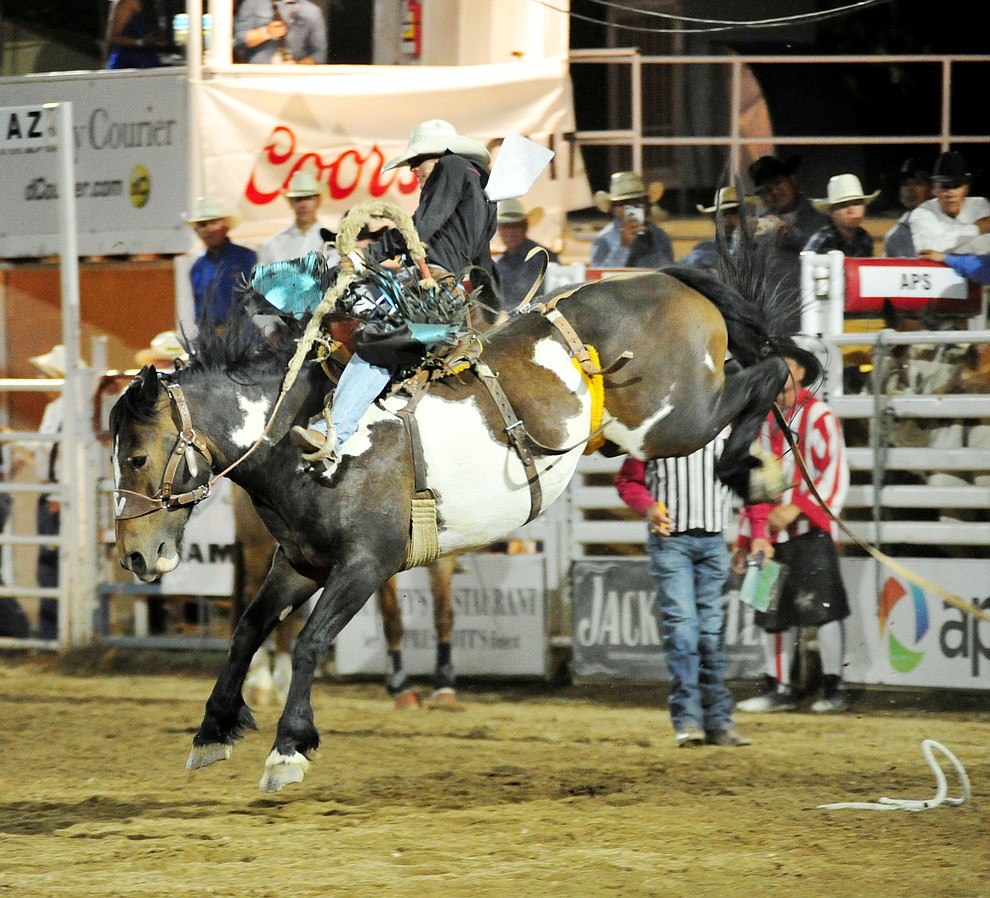 Roper Kiesner scores 78 on Table Talk in the saddle bronc riding during the first performance of the Prescott Frontier Days Rodeo Monday July 1, 2019. (Les Stukenberg/Courier)