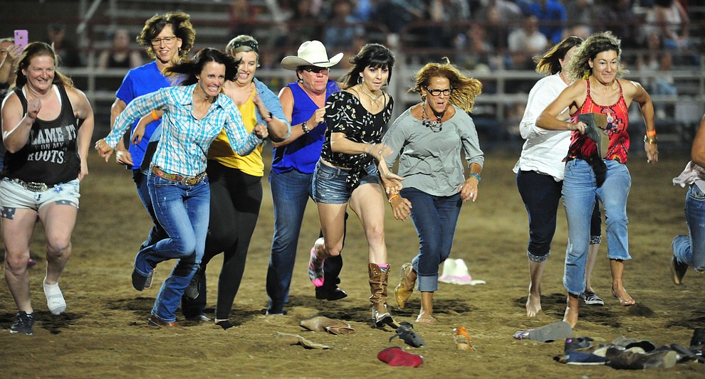 Ladies chased their boot for a chance at $250 during the first performance of the Prescott Frontier Days Rodeo Monday July 1, 2019. (Les Stukenberg/Courier)