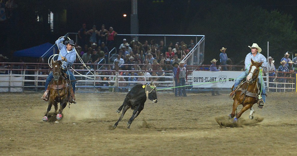 Jake South and Paul Gutierez had a 10 second run in the team roping during the first performance of the Prescott Frontier Days Rodeo Monday July 1, 2019. (Les Stukenberg/Courier)