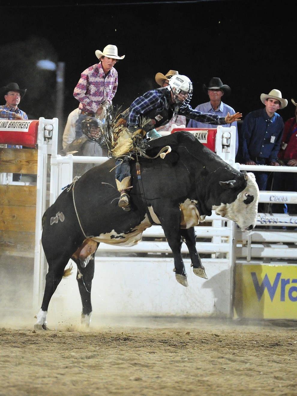 Riker Carter got a reride on Sugar Ray and scored an 82.5 to take the lead in the bull riding during the first performance of the Prescott Frontier Days Rodeo Monday July 1, 2019. (Les Stukenberg/Courier)