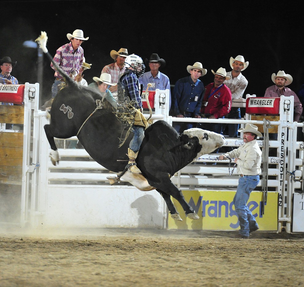 Riker Carter got a reride on Sugar Ray and scored an 82.5 to take the lead in the bull riding during the first performance of the Prescott Frontier Days Rodeo Monday July 1, 2019. (Les Stukenberg/Courier)
