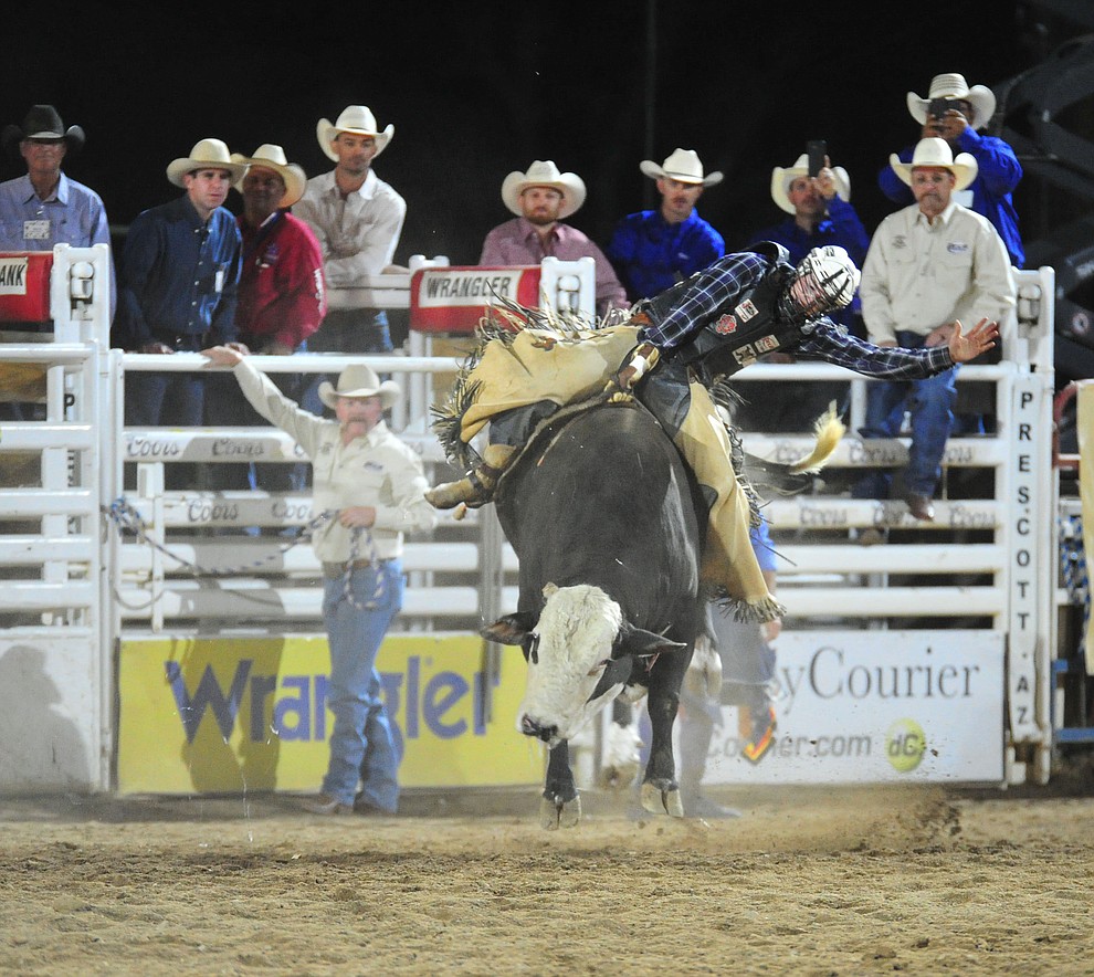 Riker Carter got a reride on Sugar Ray and scored an 82.5 to take the lead in the bull riding during the first performance of the Prescott Frontier Days Rodeo Monday July 1, 2019. (Les Stukenberg/Courier)