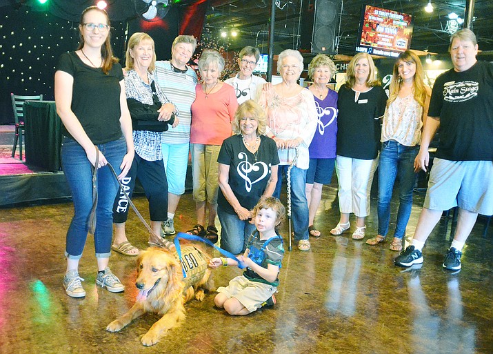 Sisterhood Foundation members presented the check to Christopher at the Cottonwood Main Stage Saturday. The Sisterhood got involved after seeing Christopher’s story on a Go Fund Me Page, explained Sisterhood member Cindi Kerber-Batttisiti. VVN/Vyto Starinskas