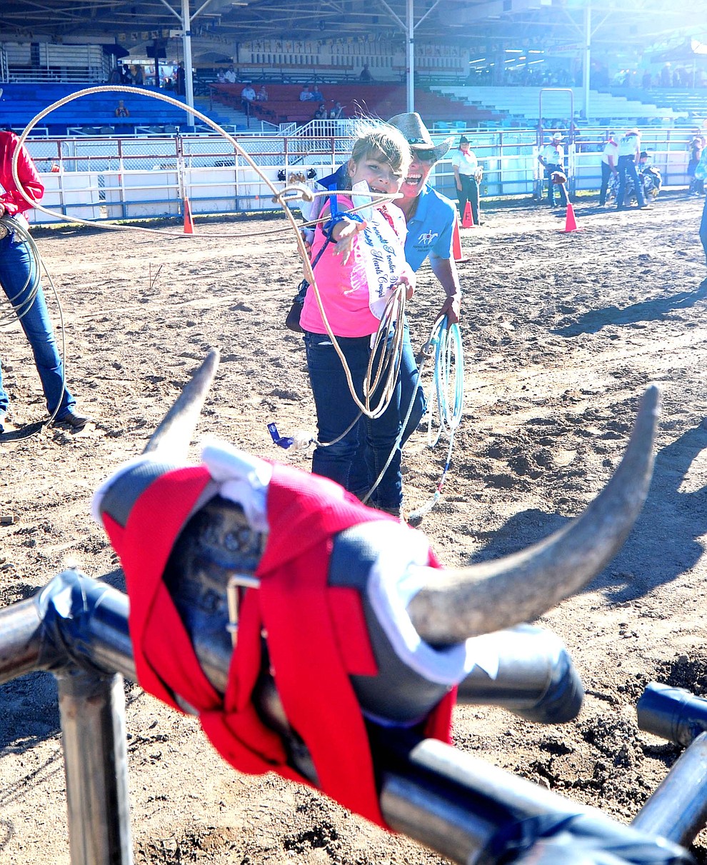 Six-year old Daisy Ellis ropes a steer during the annual Happy Hearts Rodeo for Exceptional Children at the Prescott Frontier Days Rodeo Monday July 1, 2019.  (Les Stukenberg/Courier)