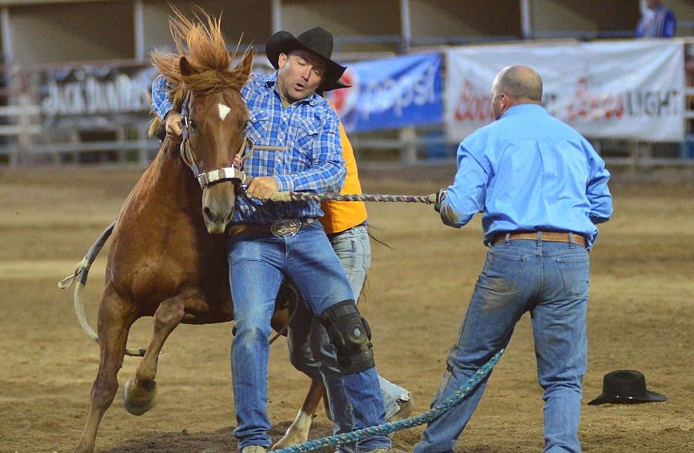 Wild Horse Race/Extreme Bronc riding action during the third performance of the Prescott Frontier Days Rodeo Wednesday July 3, 2019. (Les Stukenberg/Courier)