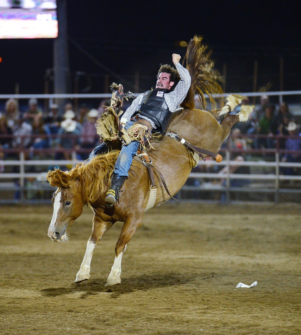 Hunter Carter on Buckle Up in the bareback riding during the third performance of the Prescott Frontier Days Rodeo Wednesday July 3, 2019. (Les Stukenberg/Courier)