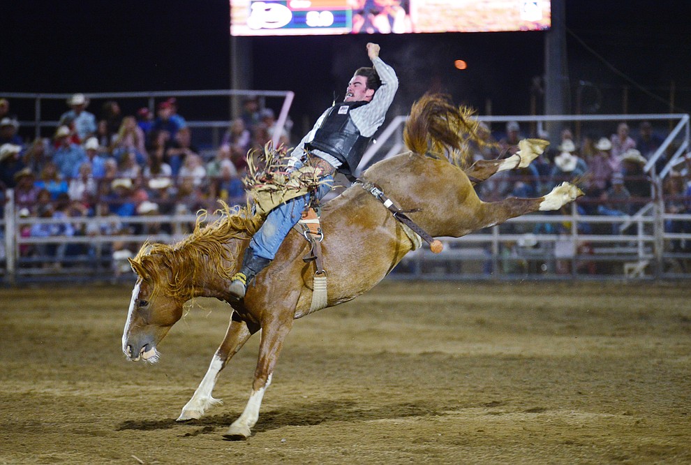 Hunter Carter on Buckle Up in the bareback riding during the third performance of the Prescott Frontier Days Rodeo Wednesday July 3, 2019. (Les Stukenberg/Courier)