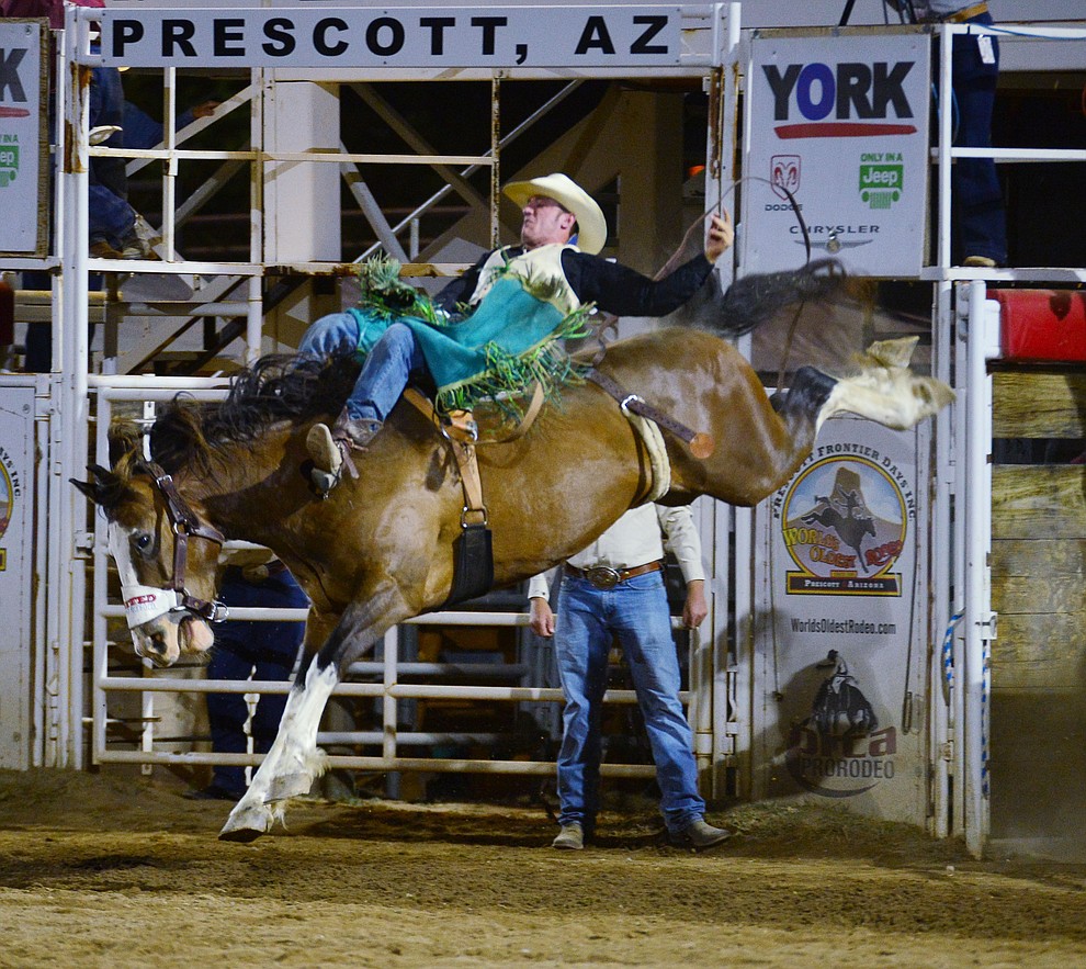 Wyatt Ortega on Pow Wow Nation in the bareback riding during the third performance of the Prescott Frontier Days Rodeo Wednesday July 3, 2019. (Les Stukenberg/Courier)