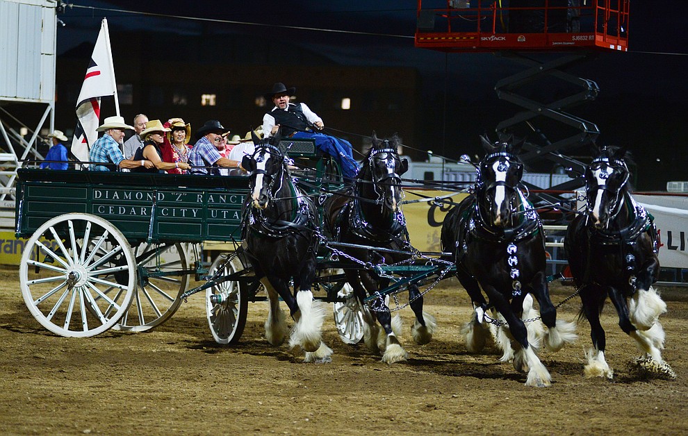 The Diamond Z English Shire Horses show off for the crowd during the third performance of the Prescott Frontier Days Rodeo Wednesday July 3, 2019. (Les Stukenberg/Courier)
