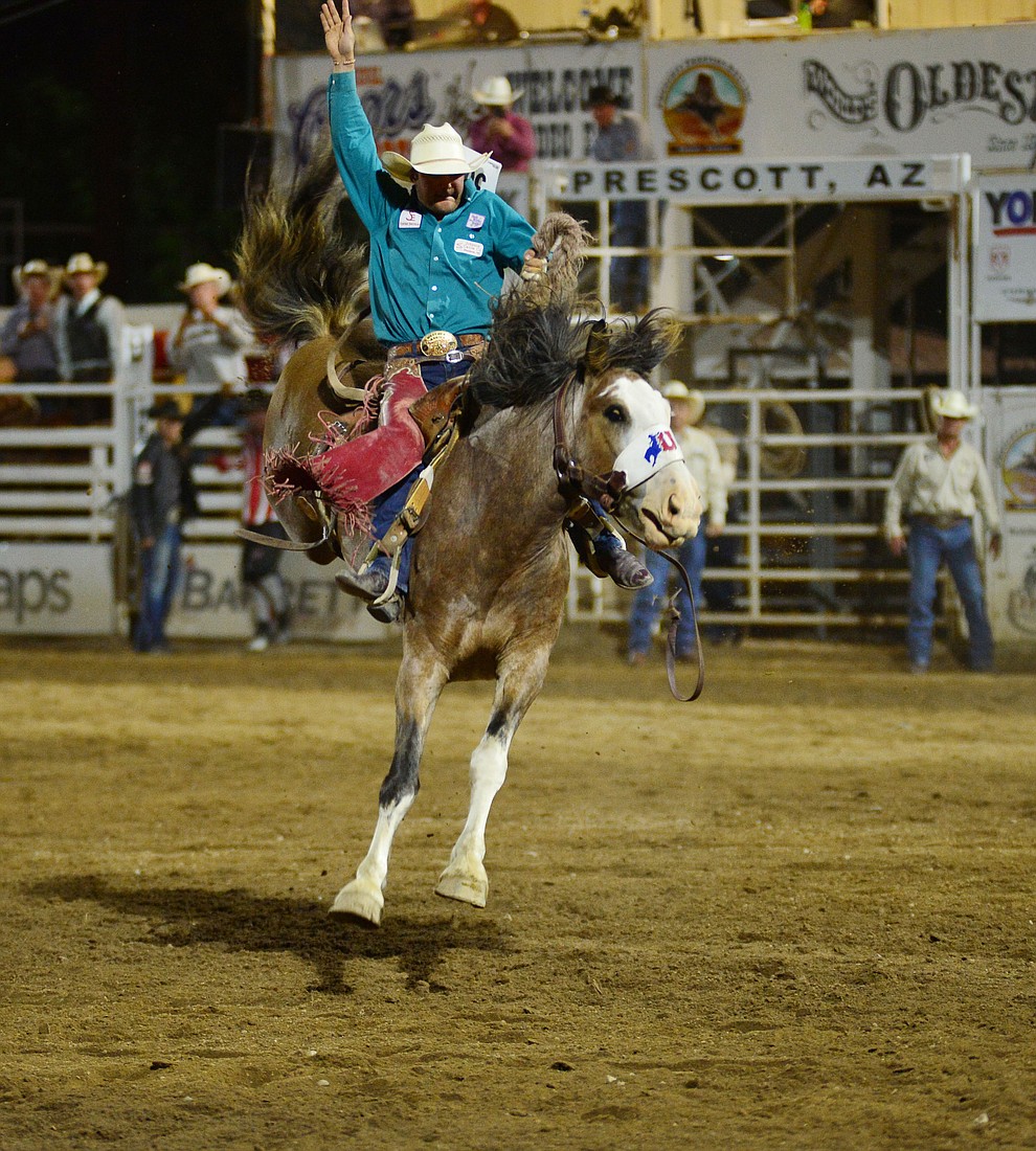 Cameron Messier on Raise Your Glass in the saddle bronc riding during the third performance of the Prescott Frontier Days Rodeo Wednesday July 3, 2019. (Les Stukenberg/Courier)