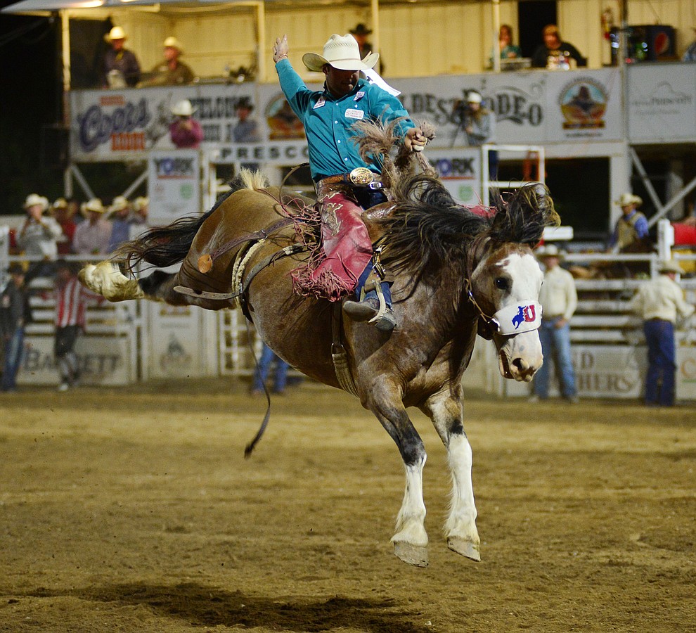 Cameron Messier on Raise Your Glass in the saddle bronc riding during the third performance of the Prescott Frontier Days Rodeo Wednesday July 3, 2019. (Les Stukenberg/Courier)