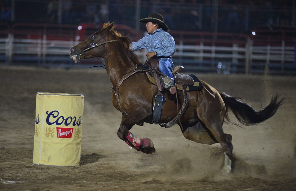 Autumnrain Chee makes a 17.95 second run in the barrel race during the third performance of the Prescott Frontier Days Rodeo Wednesday July 3, 2019. (Les Stukenberg/Courier)