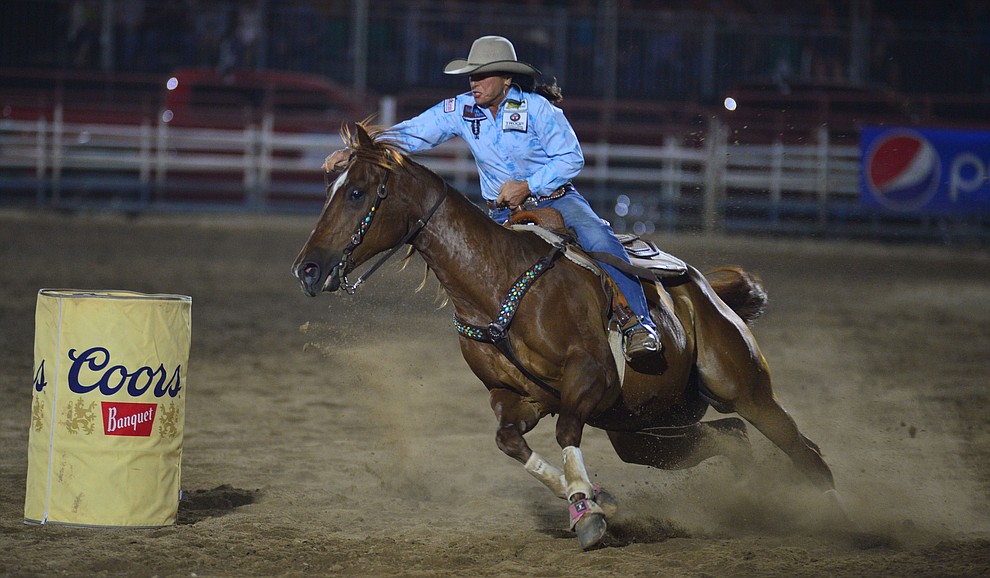 Mary Jo Camera makes a 17.76 second run in the barrel race to take the lead during the third performance of the Prescott Frontier Days Rodeo Wednesday July 3, 2019. (Les Stukenberg/Courier)
