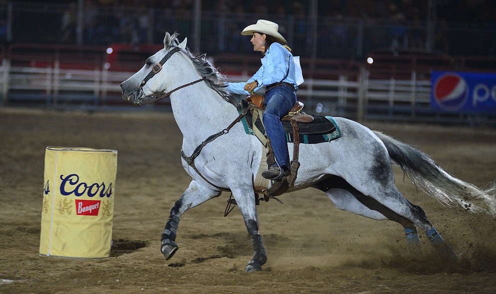 Laura Carmen makes a 18.10 second run in the barrel race during the third performance of the Prescott Frontier Days Rodeo Wednesday July 3, 2019. (Les Stukenberg/Courier)