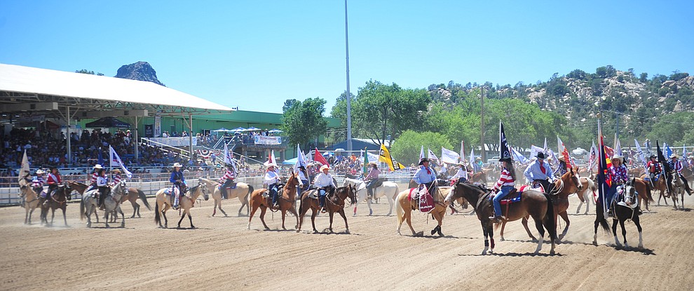 It was a star spangled grand entry during the fourth performance of the Prescott Frontier Days Rodeo Thursday July 4, 2019. (Les Stukenberg/Courier)