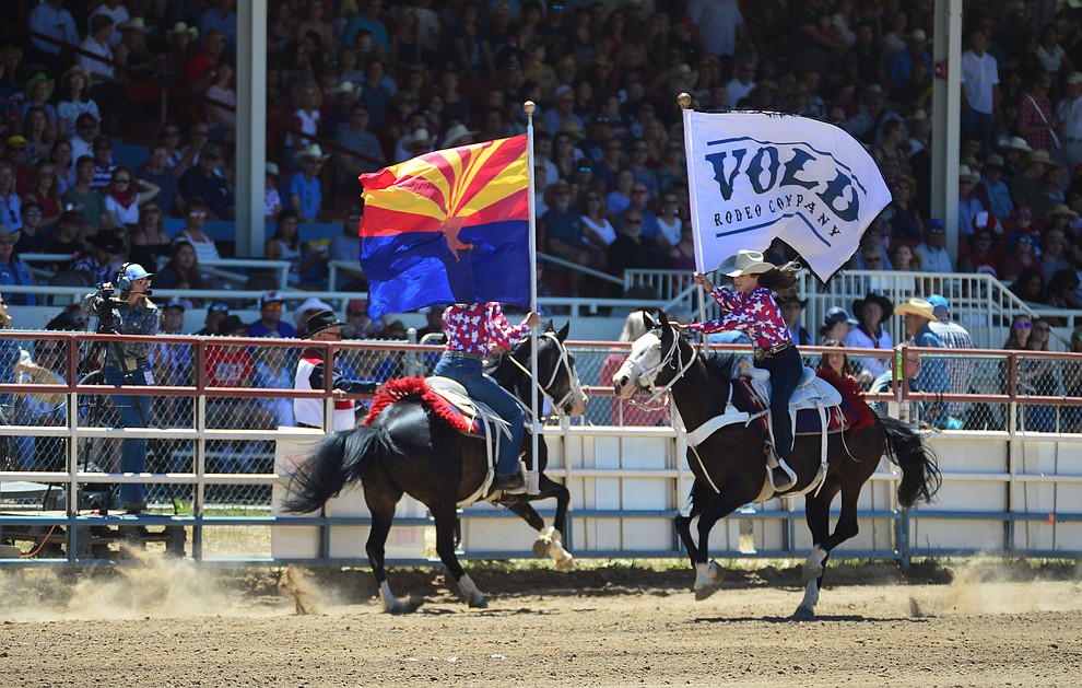It was a star spangled grand entry during the fourth performance of the Prescott Frontier Days Rodeo Thursday July 4, 2019. (Les Stukenberg/Courier)