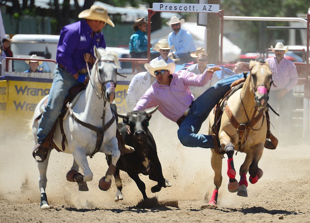 Dirk Tavenner in the steer wrestling during the fourth performance of the Prescott Frontier Days Rodeo Thursday July 4, 2019. (Les Stukenberg/Courier)