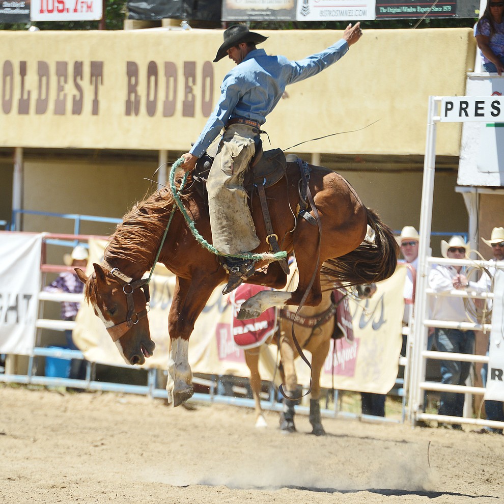 Logan Westcott in the Cowpunchers Bronc Riding during the fourth performance of the Prescott Frontier Days Rodeo Thursday July 4, 2019. (Les Stukenberg/Courier)