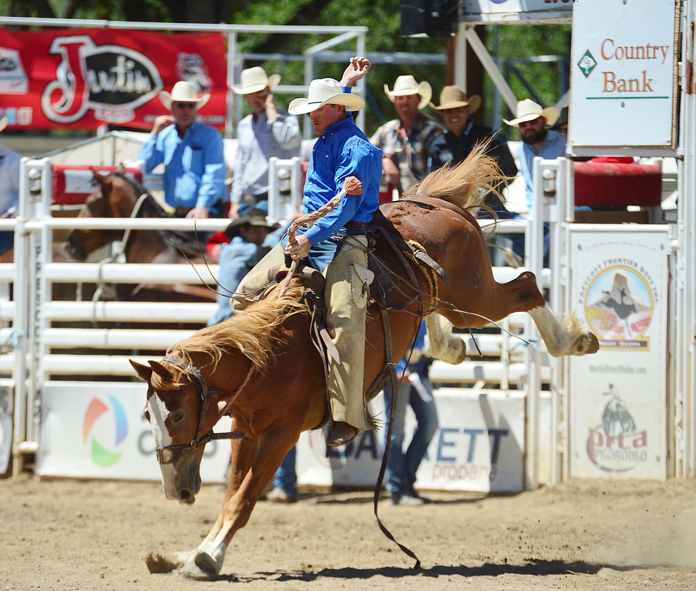 Miles Dewitt in the Cowpunchers Bronc Riding during the fourth performance of the Prescott Frontier Days Rodeo Thursday July 4, 2019. (Les Stukenberg/Courier)