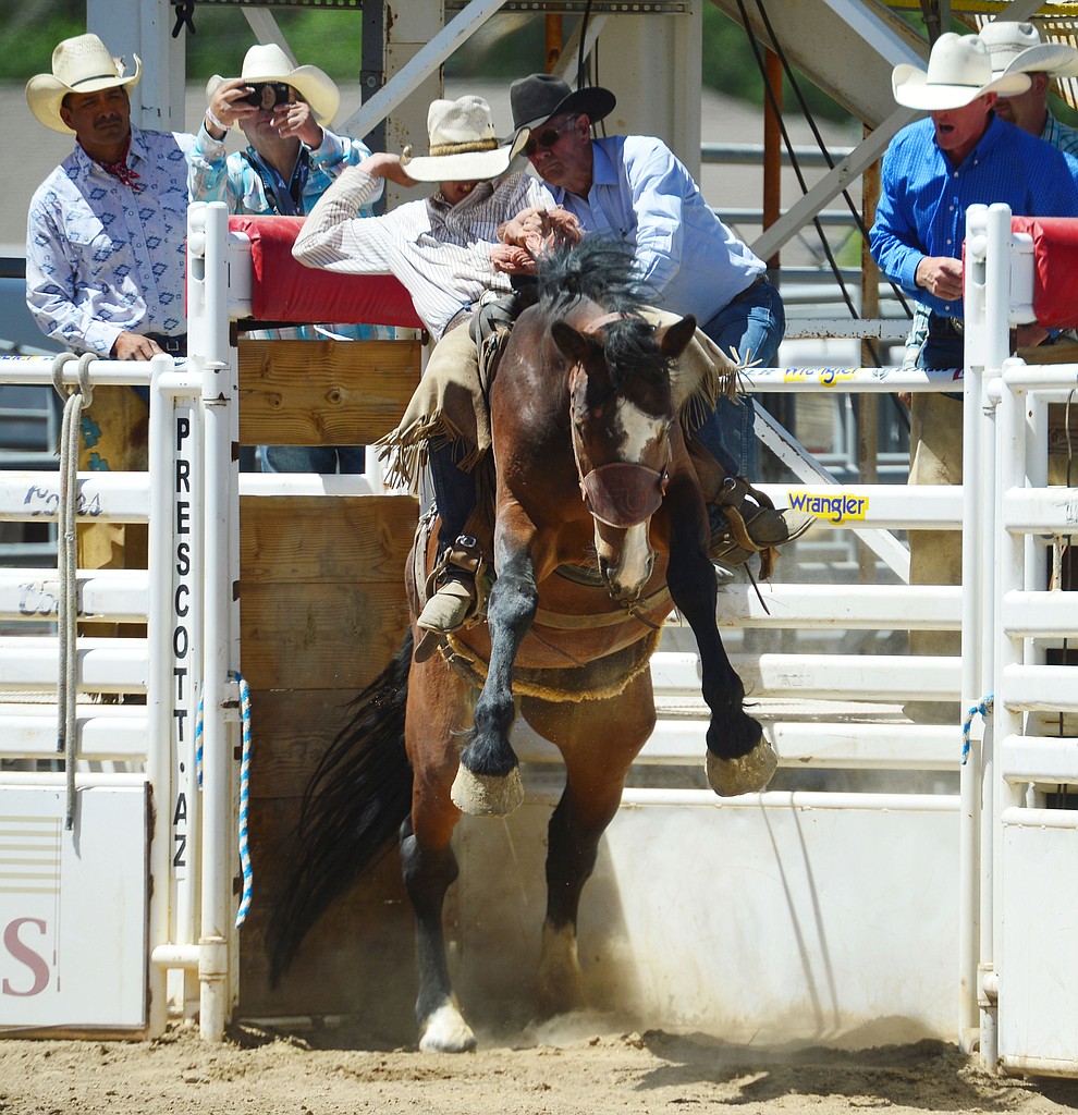 Alex Burnham in the Cowpunchers Bronc Riding during the fourth performance of the Prescott Frontier Days Rodeo Thursday July 4, 2019. (Les Stukenberg/Courier)