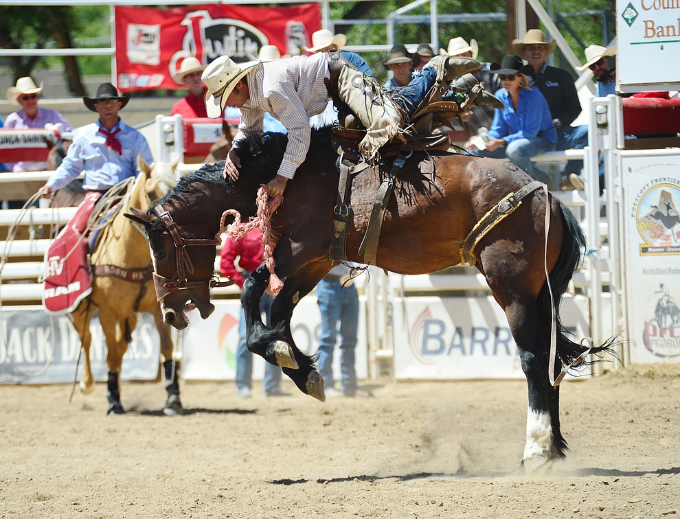 Alex Burnham in the Cowpunchers Bronc Riding during the fourth performance of the Prescott Frontier Days Rodeo Thursday July 4, 2019. (Les Stukenberg/Courier)