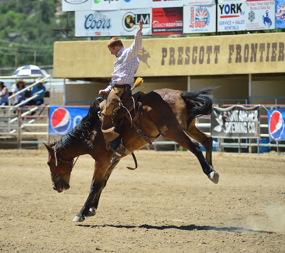 Timber Holmquist in the Cowpunchers Bronc Riding during the fourth performance of the Prescott Frontier Days Rodeo Thursday July 4, 2019. (Les Stukenberg/Courier)