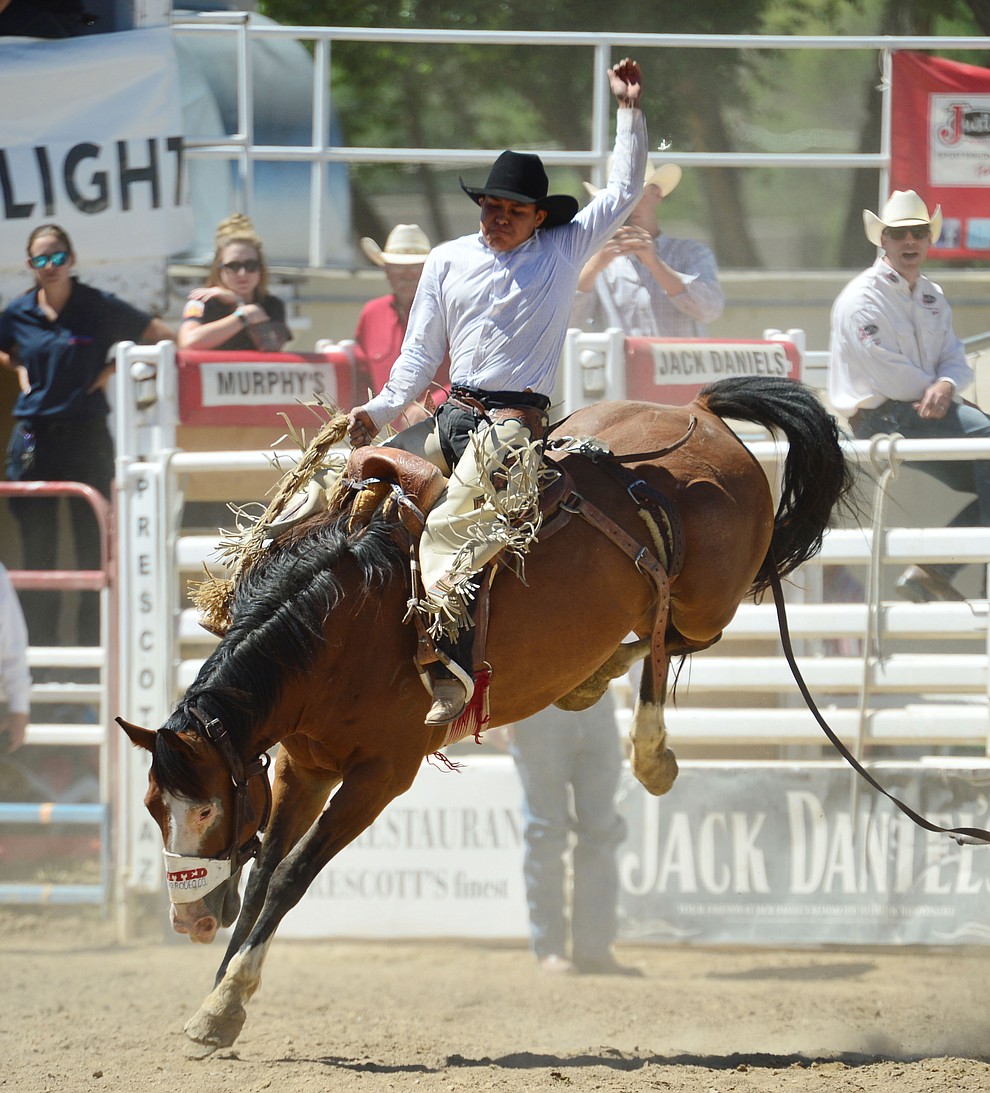 Creighton Curley on Richocette in the saddle bronc riding during the fourth performance of the Prescott Frontier Days Rodeo Thursday July 4, 2019. (Les Stukenberg/Courier)