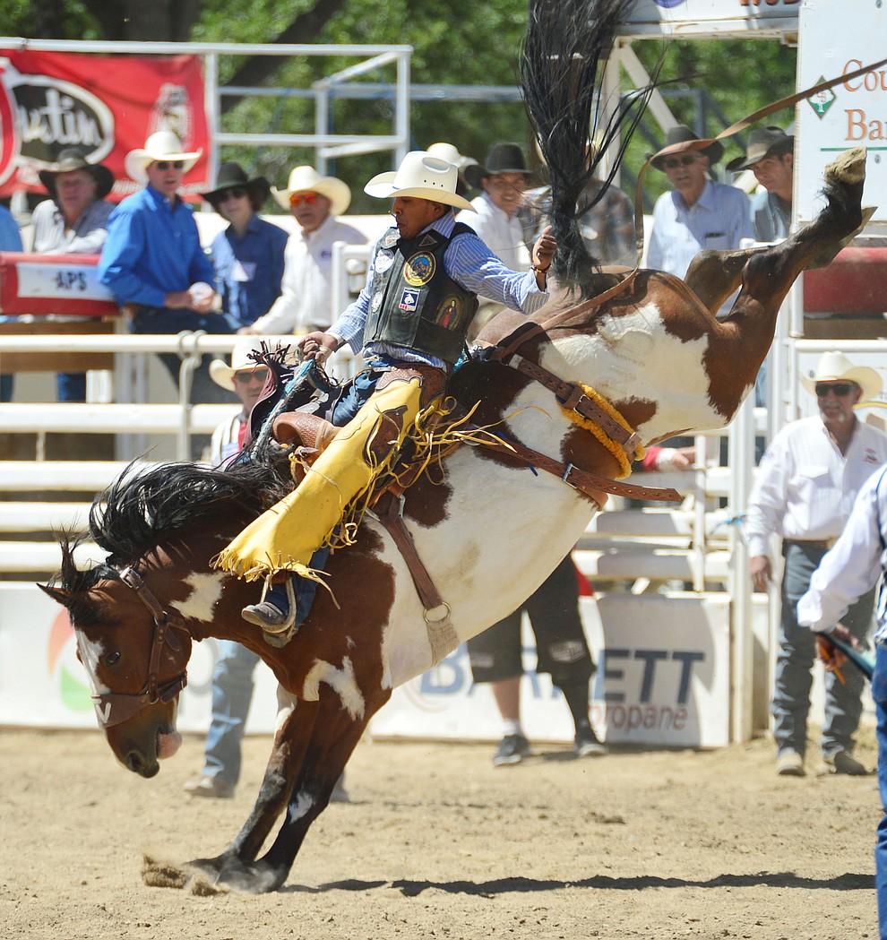 Jay Joaquin on Painted Bear scored 80 in the saddle bronc riding during the fourth performance of the Prescott Frontier Days Rodeo Thursday July 4, 2019. (Les Stukenberg/Courier)