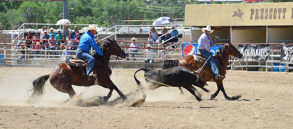 Rich Skelton and David Key in the team roping during the fourth performance of the Prescott Frontier Days Rodeo Thursday July 4, 2019. (Les Stukenberg/Courier)