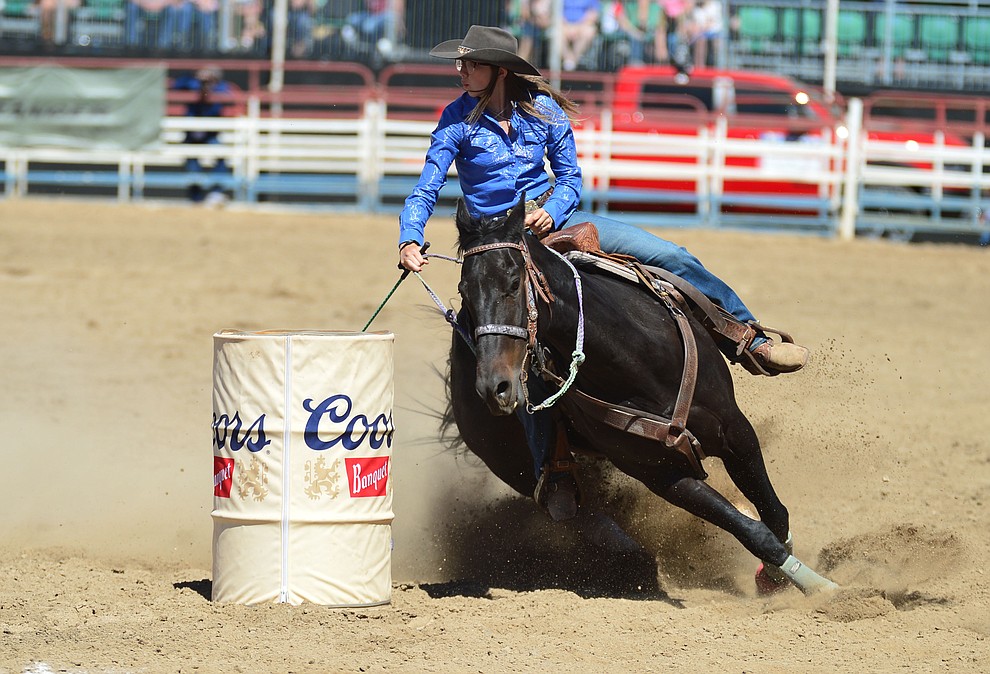 Breezy Brock in the barrel racing during the fourth performance of the Prescott Frontier Days Rodeo Thursday July 4, 2019. (Les Stukenberg/Courier)