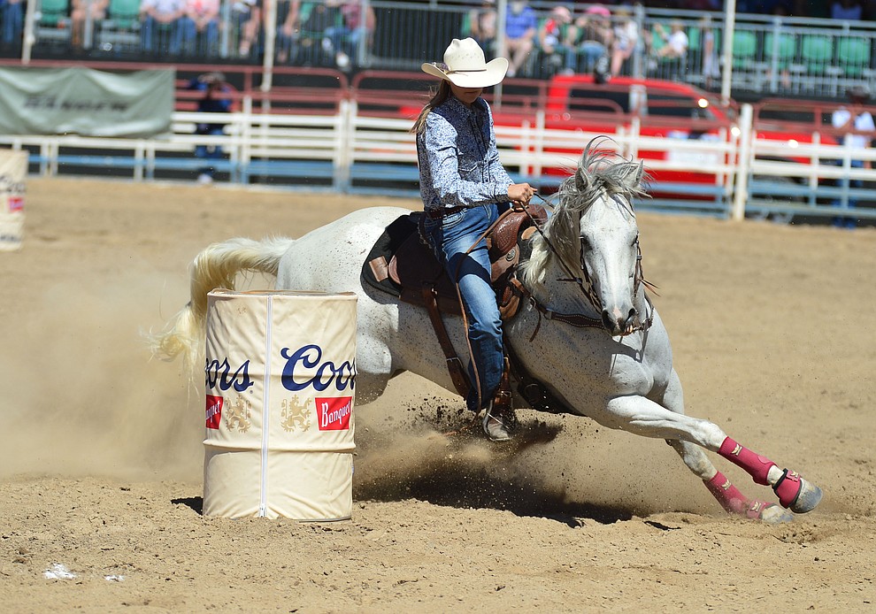 Halle Dewitt in the barrel racing during the fourth performance of the Prescott Frontier Days Rodeo Thursday July 4, 2019. (Les Stukenberg/Courier)