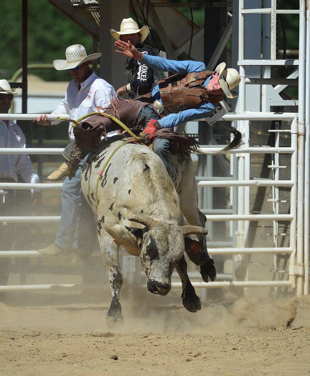 Daniel Keeping scores 86.5 on Last Cigarette in the bull riding during the fourth performance of the Prescott Frontier Days Rodeo Thursday July 4, 2019. (Les Stukenberg/Courier)