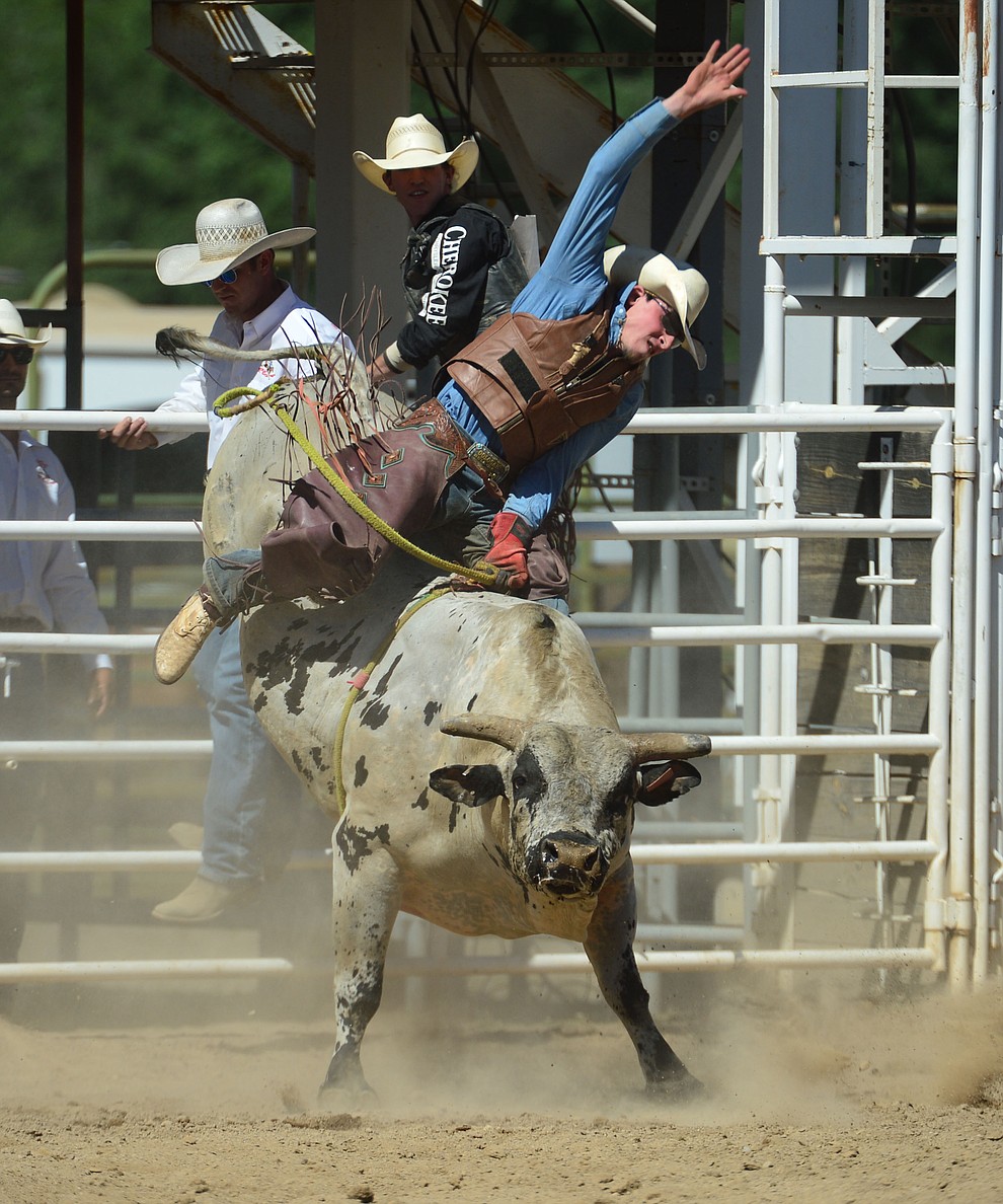 Daniel Keeping scores 86.5 on Last Cigarette in the bull riding during the fourth performance of the Prescott Frontier Days Rodeo Thursday July 4, 2019. (Les Stukenberg/Courier)
