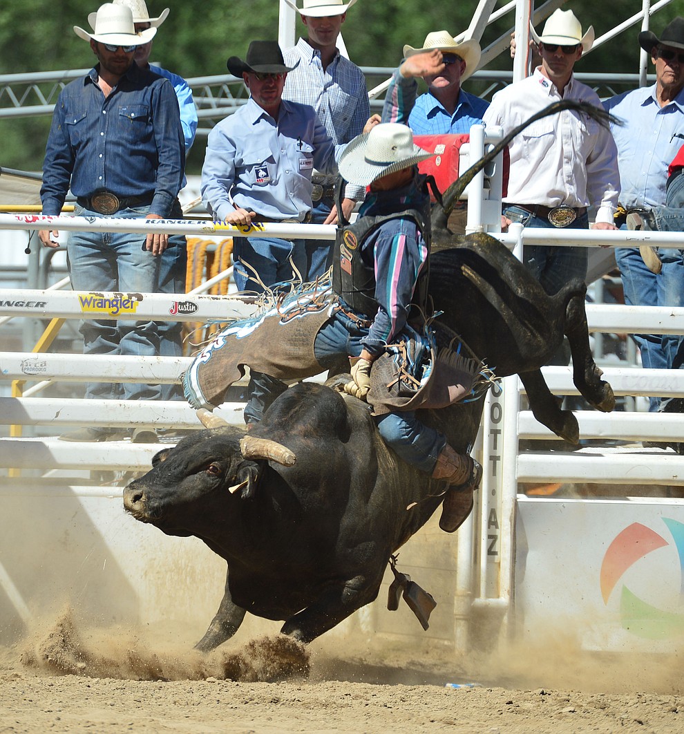 John Mast on House of Pain in the bull riding during the fourth performance of the Prescott Frontier Days Rodeo Thursday July 4, 2019. (Les Stukenberg/Courier)