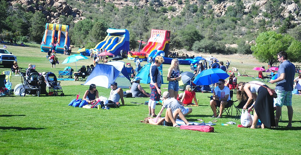 Families enjoy the grass, water slides and food at the City of Prescott's Watson Lake Fourth of July Celebration Thursday July 4, 2019. (Les Stukenberg/Courier)