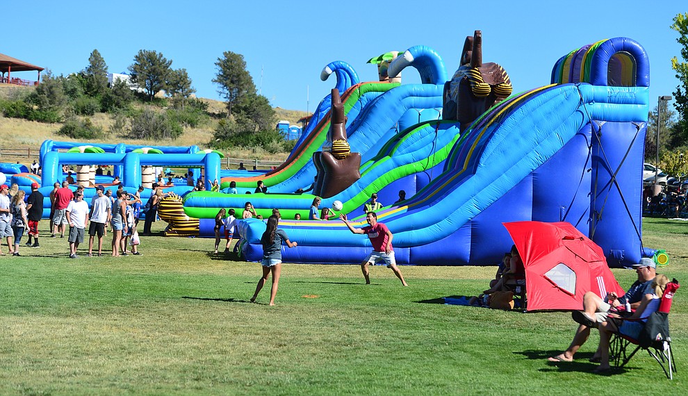 Large water slides lined the grassy area at the City of Prescott's Watson Lake Fourth of July Celebration Thursday July 4, 2019. (Les Stukenberg/Courier)