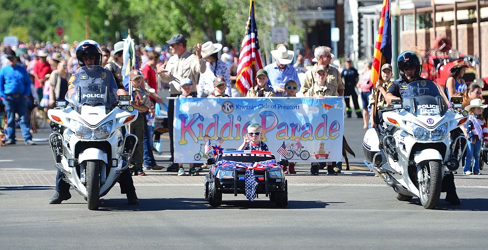 Kingston Brazell has his police car ready to roll during the 78th annual Kiwanis Kiddie Parade along Cortez Street in downtown Prescott Friday July 5, 2019. (Les Stukenberg/Courier)