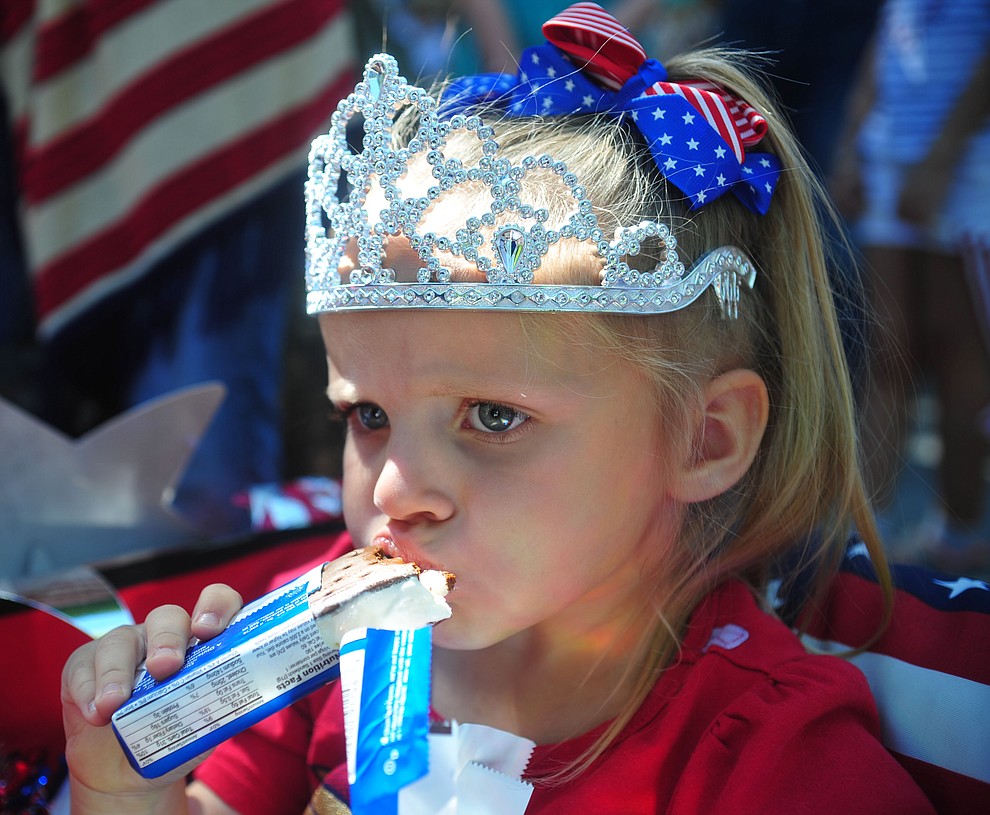 Tymbi Tompkins enjoys her ice cream sandwich following the 78th annual Kiwanis Kiddie Parade along Cortez Street in downtown Prescott Friday July 5, 2019. (Les Stukenberg/Courier)